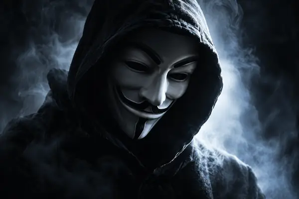 A white anonymous mask in a black hood, dramatic high contrast portrait.