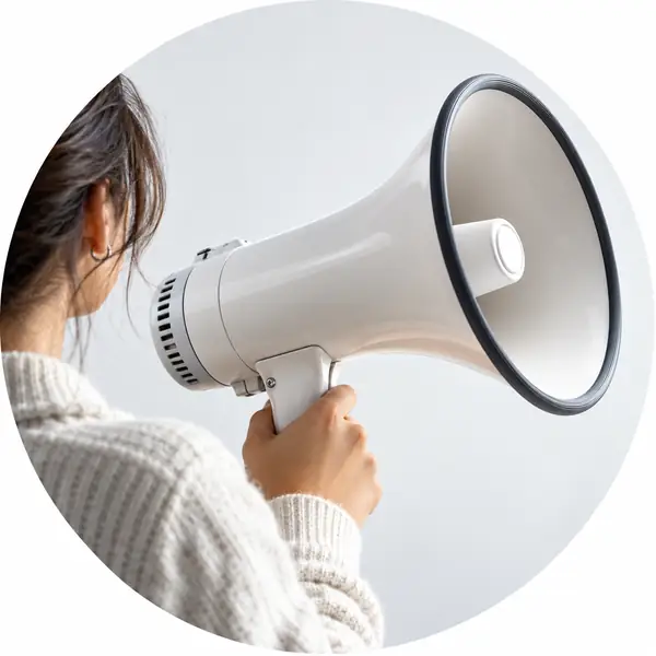 A white handheld megaphone against a clean pale background, crisp circular product portrait.
